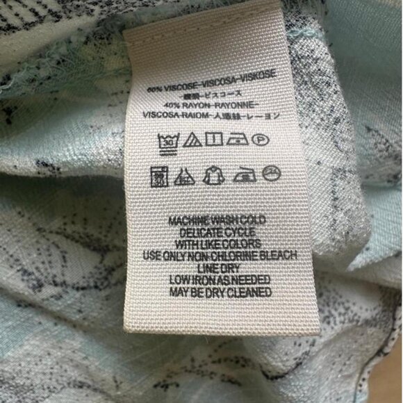 Soft and romantic wrap mini dress in a pale blue floral print by Free People - Picture 7 of 8